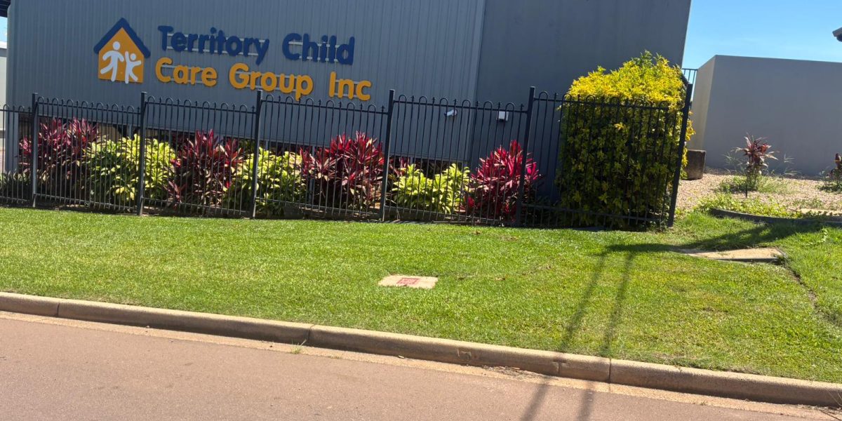 Commercial property maintenance at TCCG HQ in Darwin with landscaped edging and grounds upkeep by iScape NT.